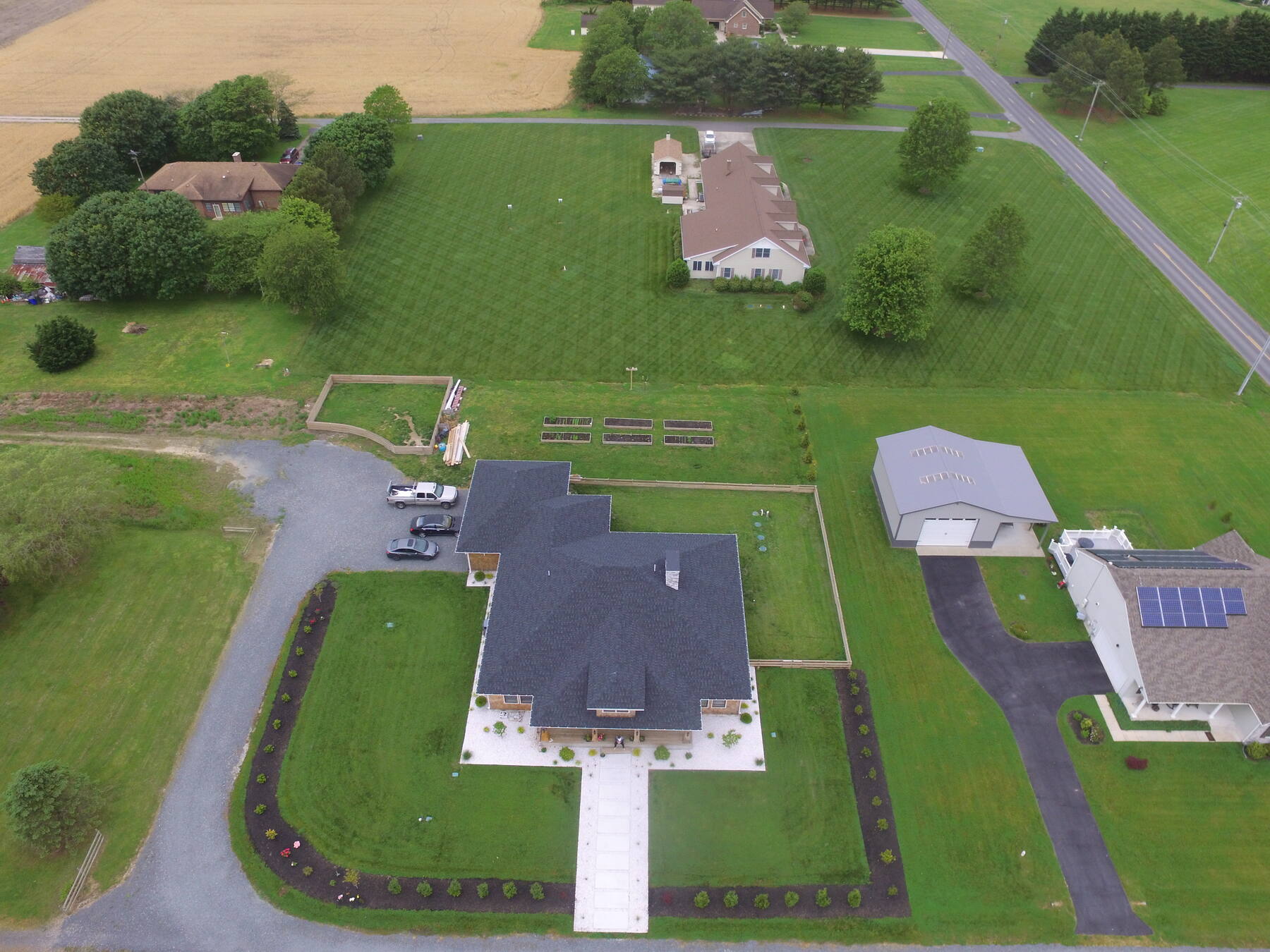 Aerial view of a custom home and grounds in Lewes, DE