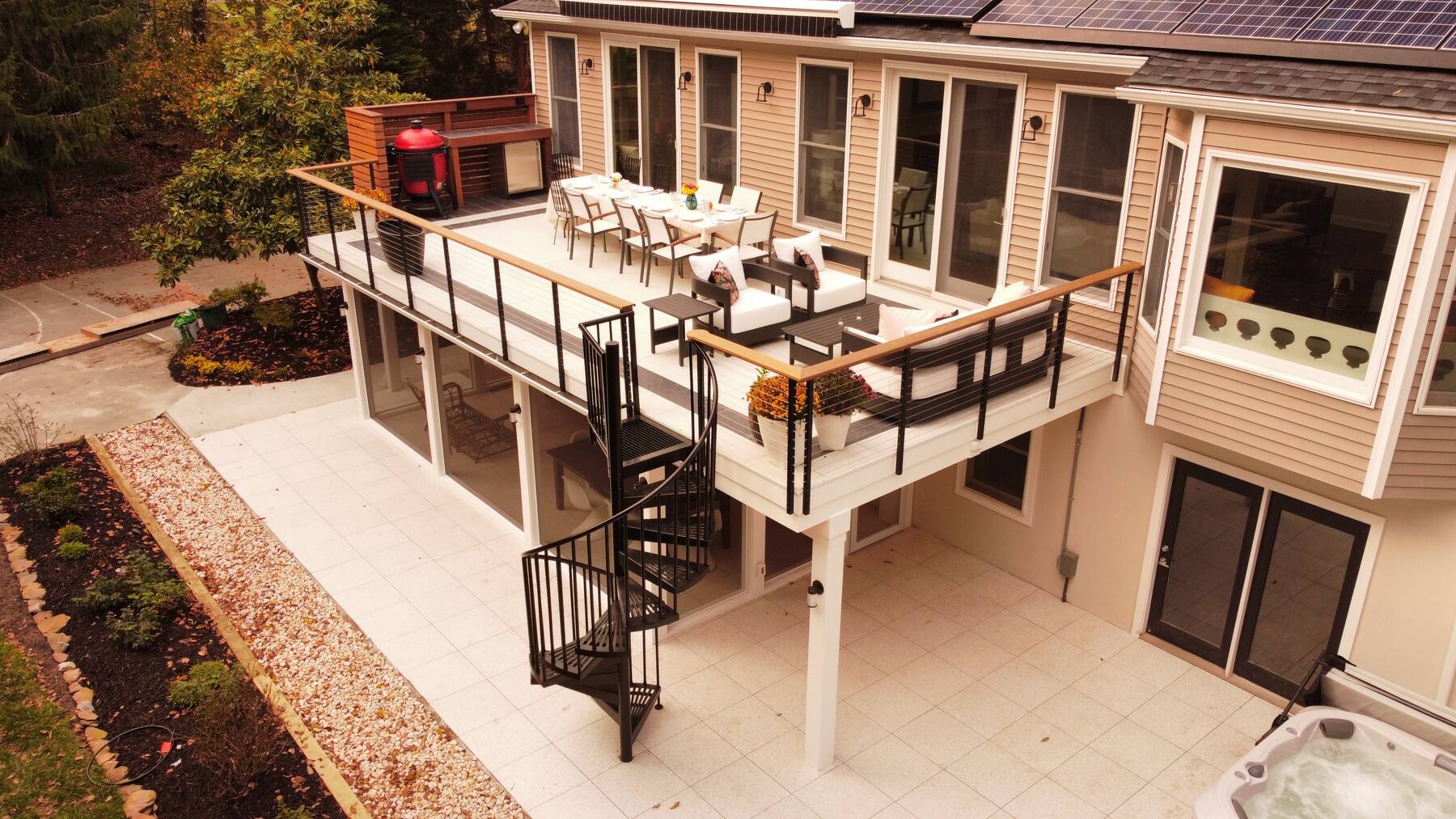 Aerial view of a custom home with rooftop deck and pool in coastal Delaware