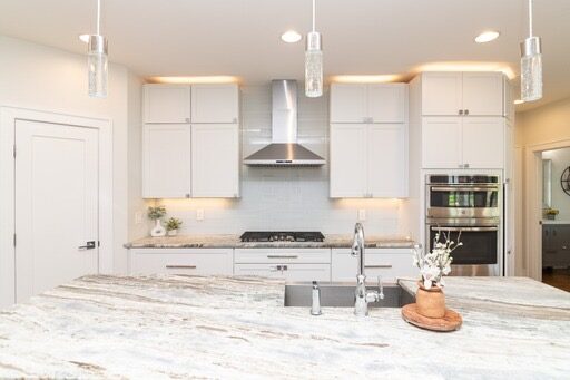 Custom home kitchen with pendant lighting in Lewes, DE