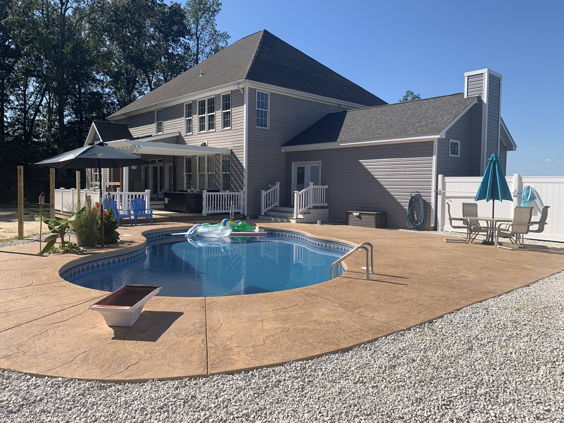 Full custom home exterior with pool in Sussex County, DE