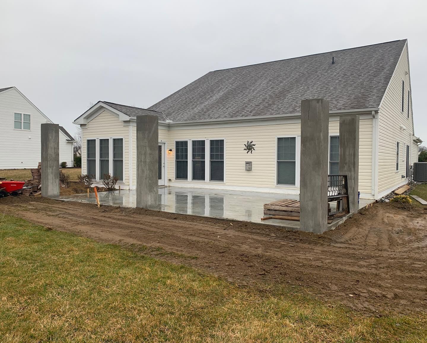 Home addition with concrete columns and poured patio in Sussex County, DE